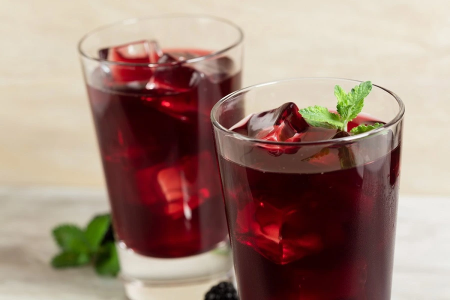 red colored drinks in two glasses